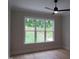 Bedroom features ample natural light and beautiful hardwood floors, creating a warm and inviting space at 2577 Silas Peak Ln, Apex, NC 27523