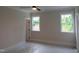 This bedroom with lots of natural light offers beautiful exterior views and a relaxing atmosphere at 2577 Silas Peak Ln, Apex, NC 27523