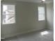 This bedroom with lots of natural light offers beautiful exterior views and a relaxing atmosphere at 2577 Silas Peak Ln, Apex, NC 27523