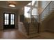 Bright foyer with wood floors, staircase and large windows at 2577 Silas Peak Ln, Apex, NC 27523