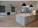 Kitchen featuring island, modern appliances and open floor plan at 2577 Silas Peak Ln, Apex, NC 27523