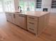 Kitchen island boasts stainless steel appliances and plenty of room for seating and meal preparation at 2577 Silas Peak Ln, Apex, NC 27523