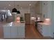 Spacious kitchen with center island, stainless appliances, and ample cabinet storage at 2577 Silas Peak Ln, Apex, NC 27523