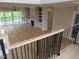 Open living room with fireplace, built-ins, and sliding glass doors to screened porch at 2577 Silas Peak Ln, Apex, NC 27523