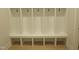 Bright mudroom features built in storage cubbies and bench at 2577 Silas Peak Ln, Apex, NC 27523