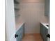 Bright pantry featuring custom cabinets, white countertops, and open shelving, perfect for organization at 2577 Silas Peak Ln, Apex, NC 27523