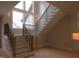 Beautiful staircase design with wood and metal detailing in open concept home at 2577 Silas Peak Ln, Apex, NC 27523