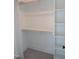 This walk-in closet features built-in shelving, drawers, and ample hanging space for organized storage at 2577 Silas Peak Ln, Apex, NC 27523