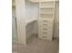 Spacious walk-in closet with custom built-in storage and a large mirror at 2577 Silas Peak Ln, Apex, NC 27523