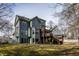 Spacious backyard featuring a deck, patio area, and mature trees, perfect for outdoor living at 2617 Charenson Pl, Raleigh, NC 27614