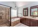 Primary bathroom featuring double vanity sinks, a soaking tub, and a tiled walk-in shower at 2617 Charenson Pl, Raleigh, NC 27614