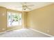 Bright bedroom with neutral carpet and natural light coming in from large window at 2617 Charenson Pl, Raleigh, NC 27614