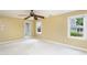 Bright bedroom with neutral carpet, ceiling fan, and natural light from the window at 2617 Charenson Pl, Raleigh, NC 27614