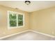 Neutral bedroom features large window offering lots of natural light and neutral carpet at 2617 Charenson Pl, Raleigh, NC 27614