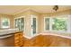 Bright breakfast nook with windows offering lots of natural light and hardwood floors at 2617 Charenson Pl, Raleigh, NC 27614