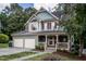 Charming home with a welcoming porch and two-car garage in a beautiful, tree-lined neighborhood at 2617 Charenson Pl, Raleigh, NC 27614