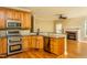 Well-equipped kitchen with stainless steel appliances and granite countertops open to the living area at 2617 Charenson Pl, Raleigh, NC 27614