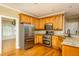 Modern kitchen with stainless steel appliances, granite countertops, and ample cabinet space at 2617 Charenson Pl, Raleigh, NC 27614