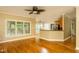 Open floor plan showing living room to kitchen with lots of natural light and hardwood floors at 2617 Charenson Pl, Raleigh, NC 27614