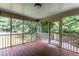 Cozy screened porch with wooden flooring and a view of the surrounding greenery at 2617 Charenson Pl, Raleigh, NC 27614