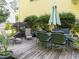 Backyard deck with outdoor seating, lush landscaping, and a tranquil setting at 2645 Ridgewell Ct, Raleigh, NC 27613