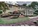 Expansive backyard with a patio, outdoor seating, and lush landscaping at 2645 Ridgewell Ct, Raleigh, NC 27613