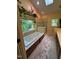 Bright bathroom featuring a soaking tub with jets, a separate glass shower, and a patterned area rug at 2645 Ridgewell Ct, Raleigh, NC 27613
