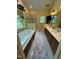 Bright bathroom with a walk-in shower, double sink vanity, and soaking tub, offering a luxurious experience at 2645 Ridgewell Ct, Raleigh, NC 27613