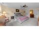 Serene bedroom with a ceiling fan and warm lighting, offering a peaceful and relaxing atmosphere at 2645 Ridgewell Ct, Raleigh, NC 27613