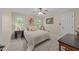 Cozy bedroom with neutral tones, plush carpet, and a ceiling fan for added comfort at 2645 Ridgewell Ct, Raleigh, NC 27613