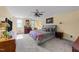 Comfortable bedroom featuring a ceiling fan, natural light, and neutral tones, creating a peaceful retreat at 2645 Ridgewell Ct, Raleigh, NC 27613