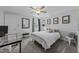 A simplistic bedroom with neutral colors and a ceiling fan, giving off a calming atmosphere at 2645 Ridgewell Ct, Raleigh, NC 27613