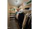 Spacious walk-in closet with built-in shelving, hanging rods, and ample storage space at 2645 Ridgewell Ct, Raleigh, NC 27613