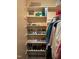 Close-up of the walk-in closet with built-in shelving for clothing and shoe storage at 2645 Ridgewell Ct, Raleigh, NC 27613