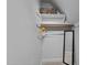 Minimalist closet with a single rod, shelf, and mirror for storing clothes and accessories at 2645 Ridgewell Ct, Raleigh, NC 27613