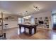 Spacious game room with a pool table, recessed lighting, and built-in shelving at 2645 Ridgewell Ct, Raleigh, NC 27613