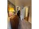 Hallway entrance to walk-in closet, with a glimpse into the bedroom and a decorative desk at 2645 Ridgewell Ct, Raleigh, NC 27613