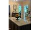 Kitchen island featuring granite countertop, eat-in space, and natural light at 2645 Ridgewell Ct, Raleigh, NC 27613