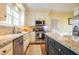 Stylish kitchen with stainless steel appliances, granite countertops, and white cabinetry at 2645 Ridgewell Ct, Raleigh, NC 27613
