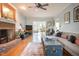 Inviting living room with a brick fireplace and ample seating for Gathering and friends at 2645 Ridgewell Ct, Raleigh, NC 27613