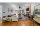Cozy living room features a brick fireplace, hardwood floors, plush seating, and stylish decor, creating a warm and inviting atmosphere at 2645 Ridgewell Ct, Raleigh, NC 27613