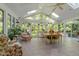 Bright and airy sunroom with tile floors, large windows, skylights, and views of the surrounding greenery at 2645 Ridgewell Ct, Raleigh, NC 27613