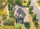 Aerial view of a home featuring a back patio, covered porch, and beautifully landscaped backyard at 268 The Preserve Trl, Chapel Hill, NC 27517