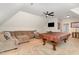 Spacious basement with a large sectional, a pool table, and a cozy atmosphere at 268 The Preserve Trl, Chapel Hill, NC 27517