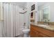 Well-lit bathroom with tub and shower, vanity with granite countertop, and neutral accents at 268 The Preserve Trl, Chapel Hill, NC 27517