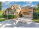 Charming home featuring a stone facade, multi-car garage, and well-manicured landscaping at 268 The Preserve Trl, Chapel Hill, NC 27517