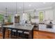 Well-lit kitchen with granite countertops, stainless steel appliances, and a large island with seating at 268 The Preserve Trl, Chapel Hill, NC 27517