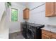 Convenient laundry room with modern appliances, ample storage, and a functional layout at 268 The Preserve Trl, Chapel Hill, NC 27517