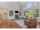 Elegant living room featuring a stone fireplace, built-in shelving, and ample seating at 268 The Preserve Trl, Chapel Hill, NC 27517