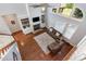 Overhead view of the living room highlighting the fireplace, built-ins, and large windows at 268 The Preserve Trl, Chapel Hill, NC 27517
